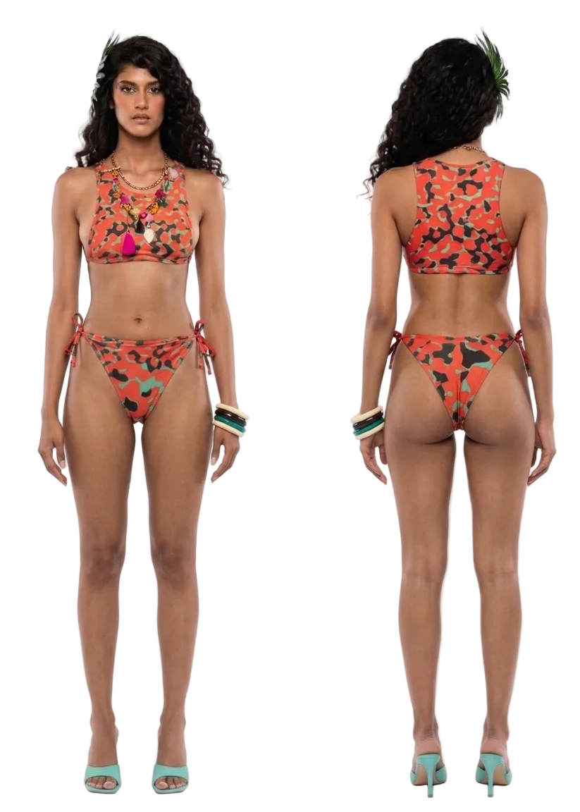 A model shown from the front and back wearing a two-piece bikini with a vibrant orange, black, and green abstract floral pattern. The image is set against a plain white studio background.