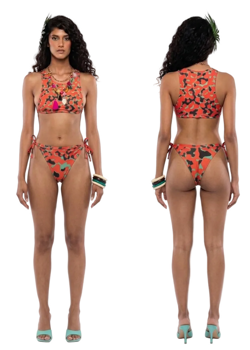 A model shown from the front and back wearing a two-piece bikini with a vibrant orange, black, and green abstract floral pattern. The image is set against a plain white studio background.