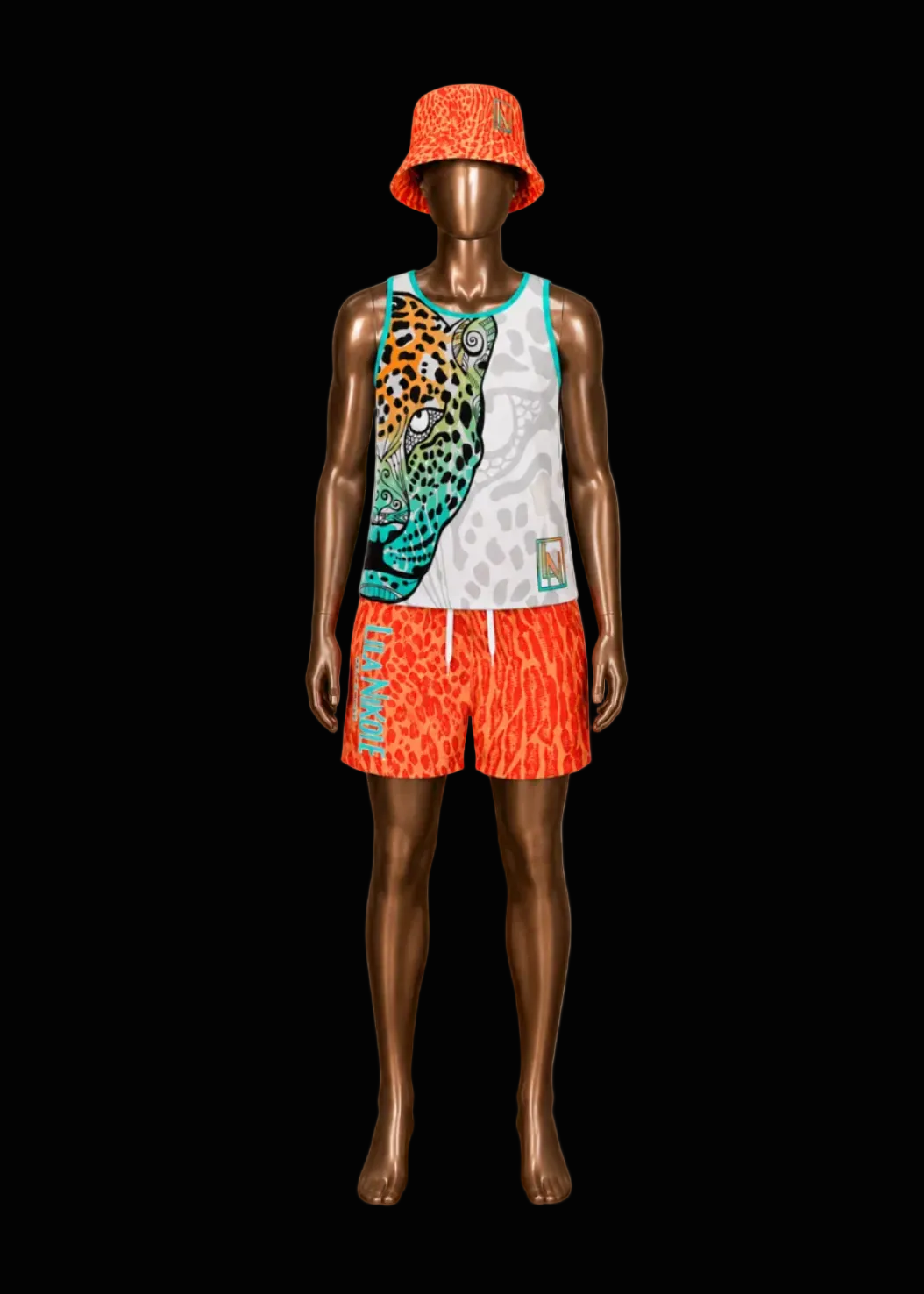 A mannequin wearing a matching swimwear set: a sleeveless tank top and shorts with a bold leopard print in orange, black, white, and turquoise, plus a matching orange bucket hat, shown against a solid black background.